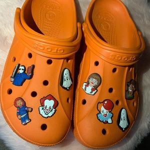 USED Mens 9 Woman’s 11 Orange Crocs with Halloween/Horror charms.